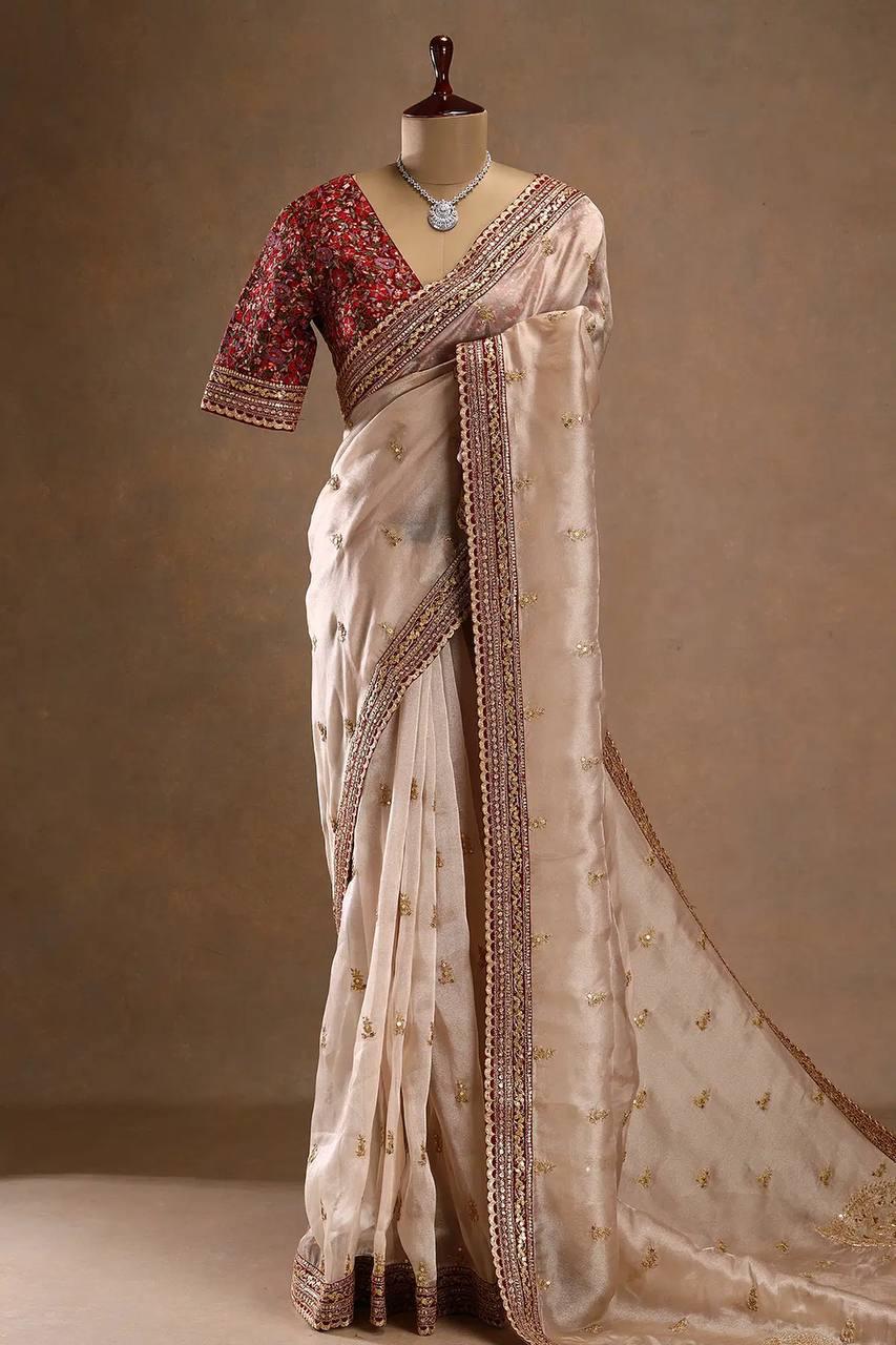 FANTABULOUS BEIGE JIMMY CHOO SILK SAREE WITH POSH BLOUSE PIECE